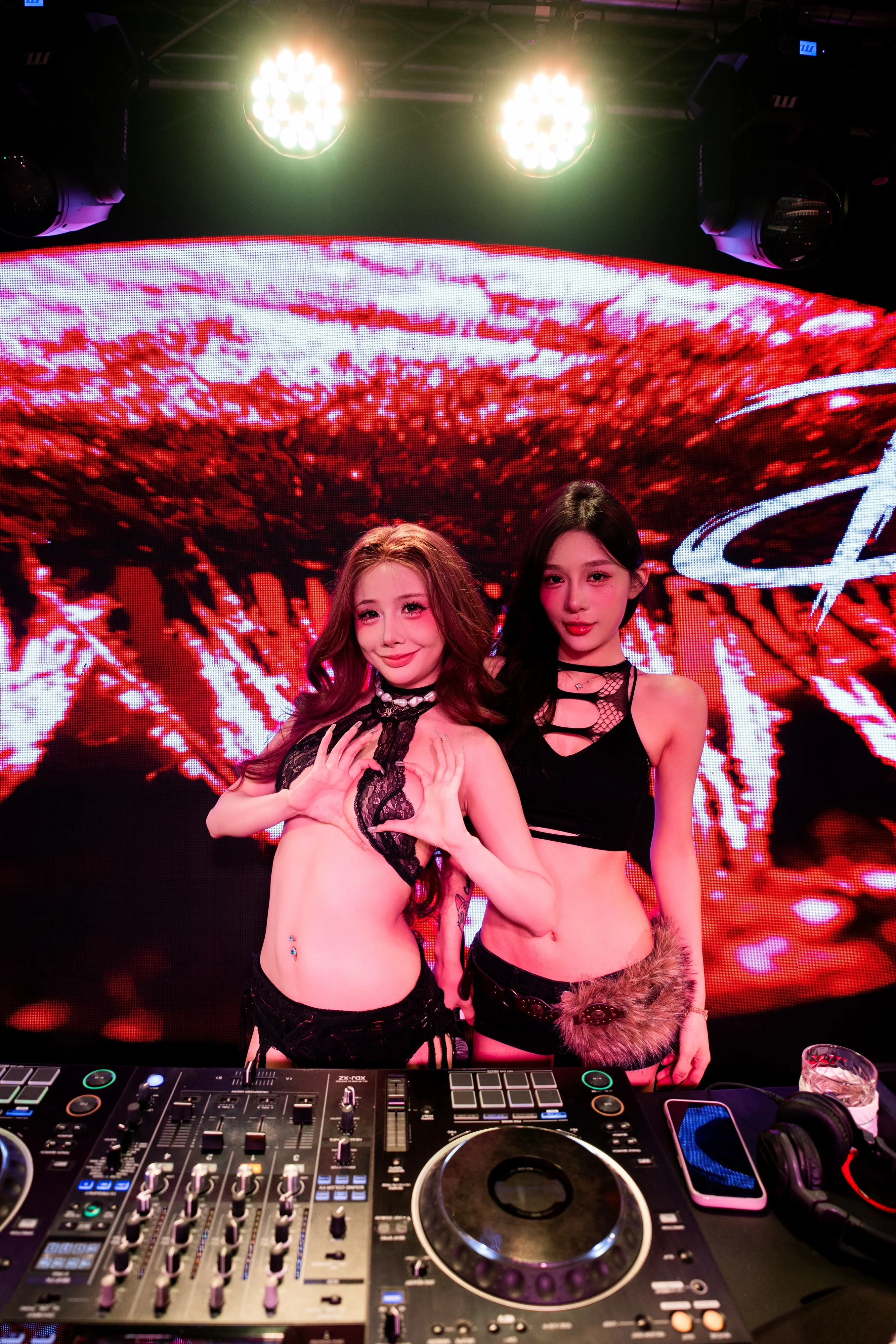 Paragon DJs performing behind the decks